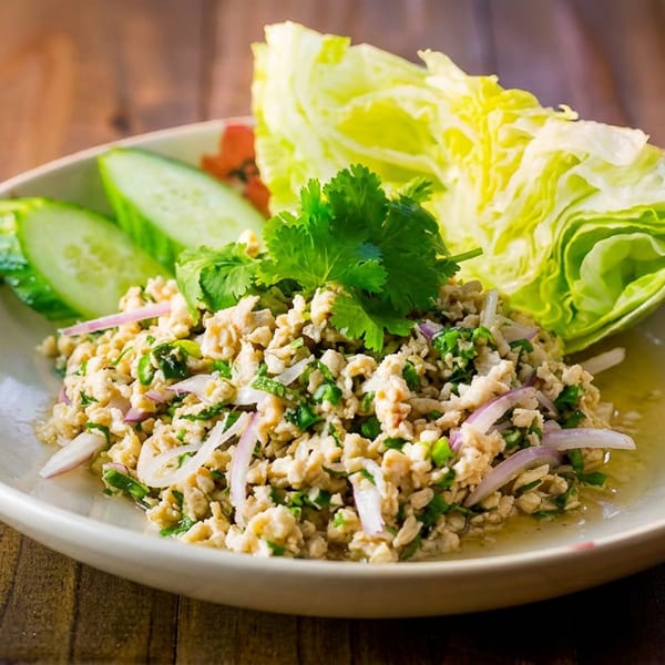 Larb Gai, a Thai minced chicken salad with red onions, cilantro, and lettuce wraps.