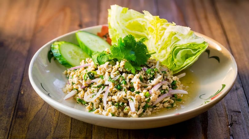 Larb Gai, a Thai minced chicken salad with red onions, cilantro, and lettuce wraps.